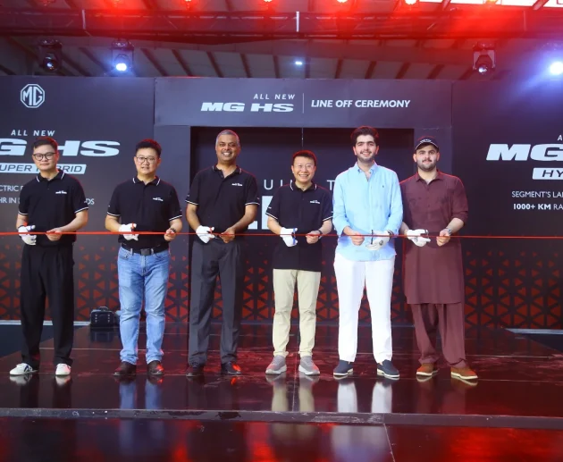 MG Pakistan officials holding a ribbon-cutting ceremony for the CKD line-off of the All New MG HS Hybrid+ and Super Hybrid vehicles.