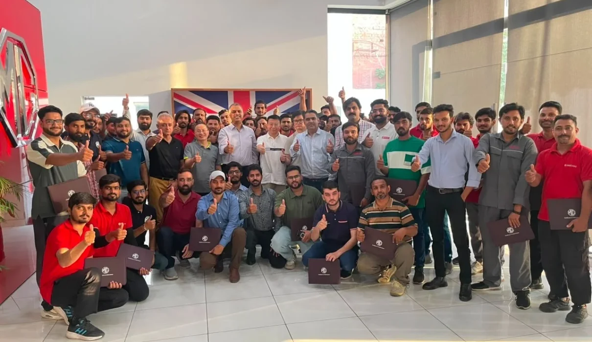 MG Motor Pakistan dealership technicians receiving hands-on hybrid vehicle battery training as part of nationwide after-sales readiness for MG HS Hybrid+ and MG HS Super Hybrid.