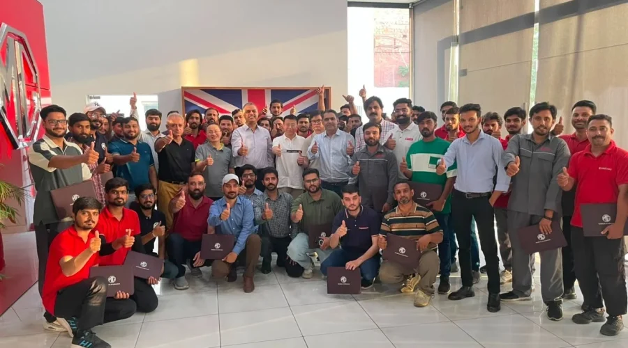 MG Motor Pakistan dealership technicians receiving hands-on hybrid vehicle battery training as part of nationwide after-sales readiness for MG HS Hybrid+ and MG HS Super Hybrid.