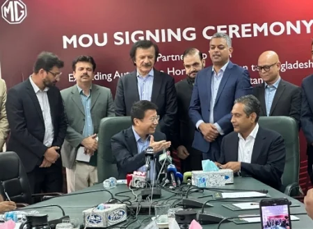 MG JW Automobile Pakistan and RANCON representatives shake hands during MoU signing ceremony for vehicle exports to Bangladesh
