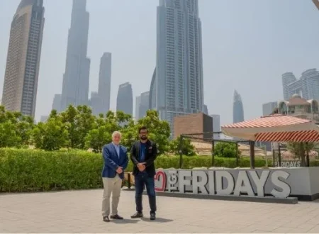 TGI Fridays representatives in front of a TGI Fridays location as the brand announces plans to expand across Pakistan through a development agreement with Meerab Hospitality.